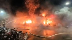 In this image taken from video by Taiwan's EBC, firefighters battle a blaze at a building in Kaohsiung, in southern Taiwan on Thursday, Oct. 14, 2021. A fire engulfed a 13-story building overnight in southern Taiwan, the island's semi-official Central News Agency reported Thursday. (EBC via AP )