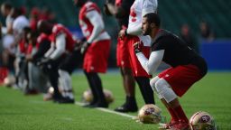 San Francisco 49ers quarterback Colin Kaepernick warms up during a San Francisco 49ers training session at Allianz Park on Oct. 25, 2013 in London, England.  
