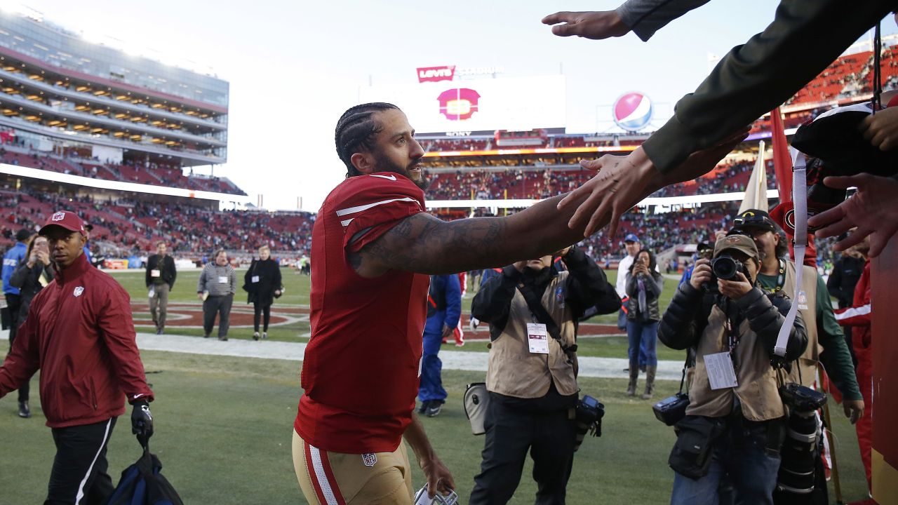 Kaepernick greets fans after a game.