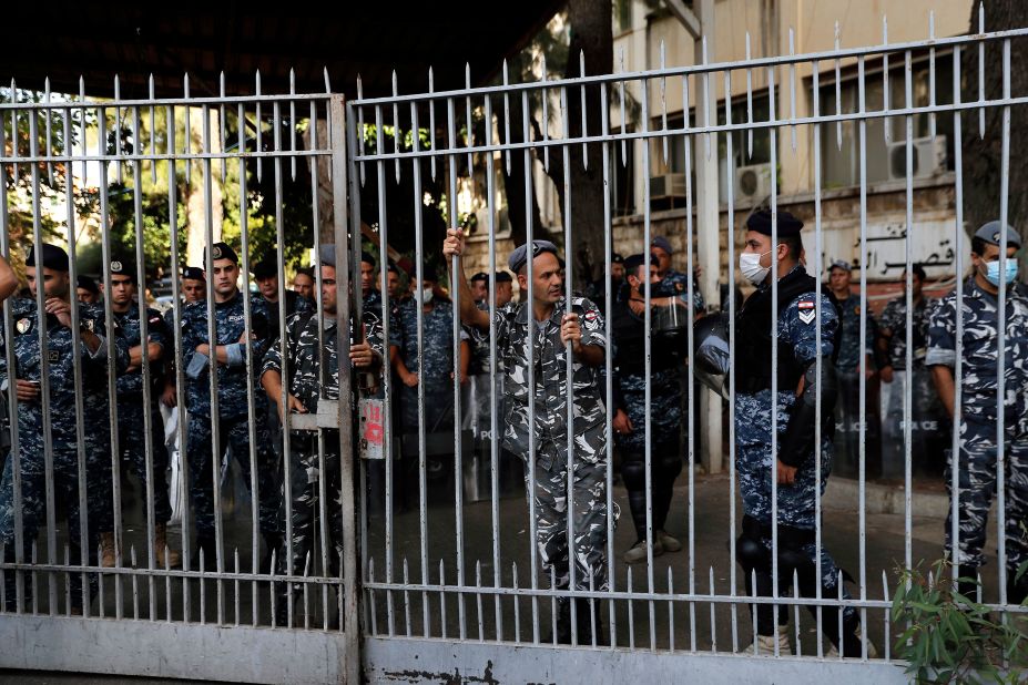 Police officers stand guard inside the Palace of Justice.