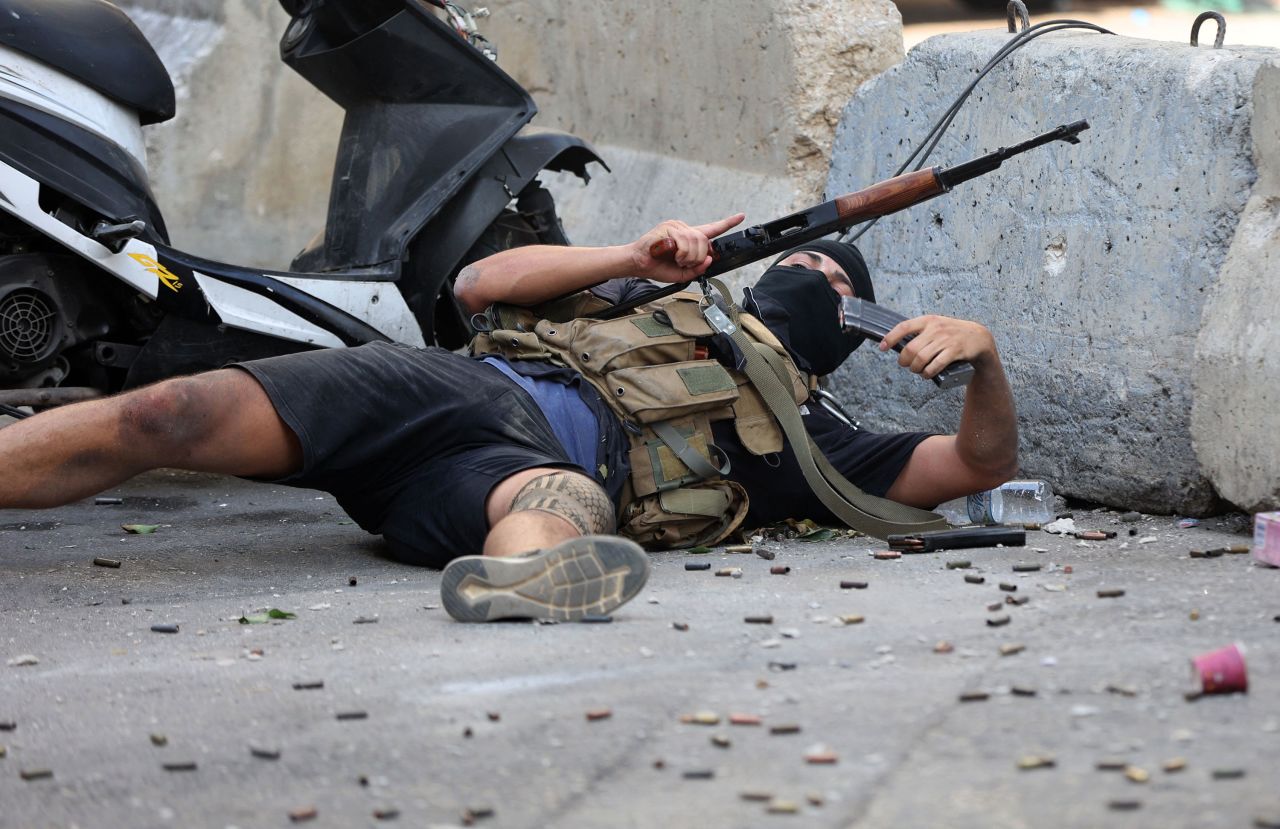 A man reloads during the clashes.