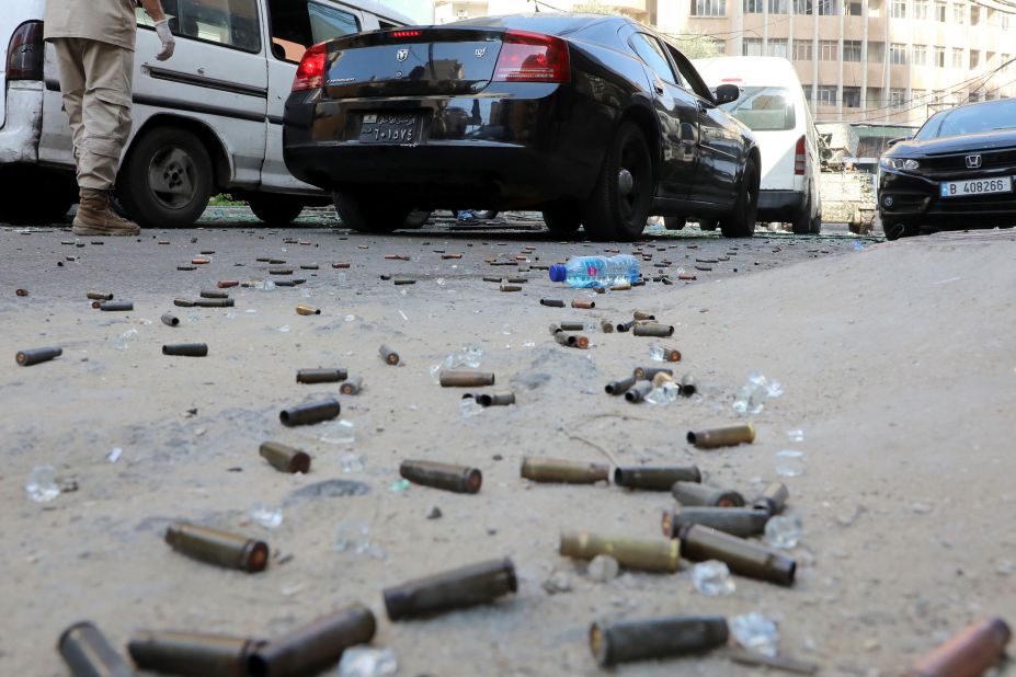 Bullet shells are seen on the ground.
