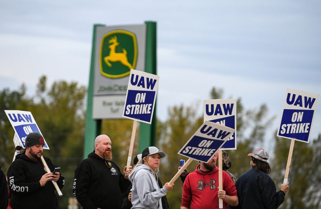 Strikers picket outside the John Deere factory in Davenport, Iowa, on the first day of the strike Friday.
