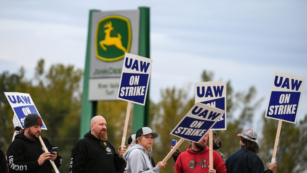 Strikers picket outside the John Deere factory in Davenport, Iowa, on the first day of the strike Friday.