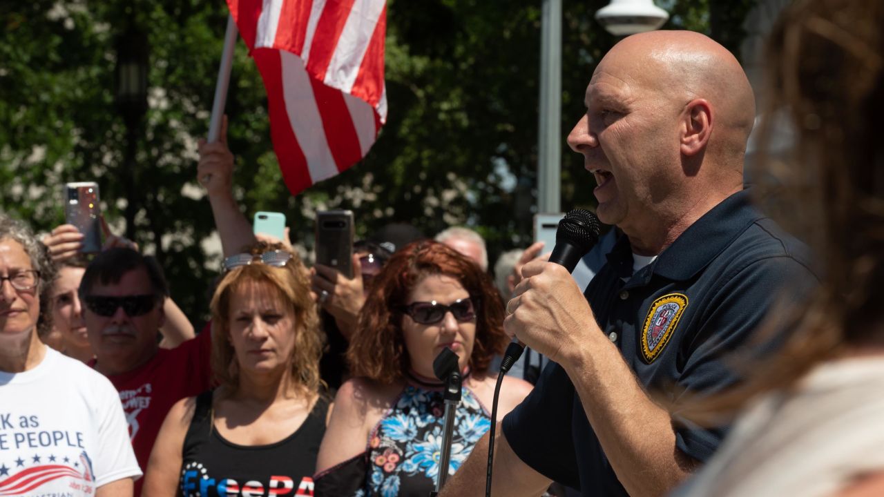 State Senator Doug Mastriano speaks to the ReOpen PA rally, Sandy Weyer who is currently being investigated by the Department of Justice for her actions at the January 6th Insurrection.