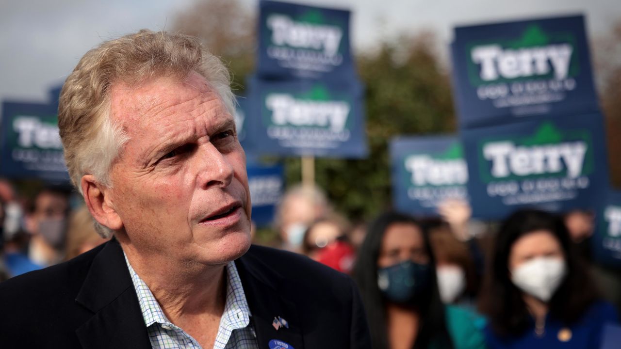 Former Virginia Gov. Terry McAuliffe, Democratic gubernatorial candidate for Virginia for a second term, answers questions from reporters after casting his ballot during early voting on October 13, 2021 in Fairfax, Virginia. 