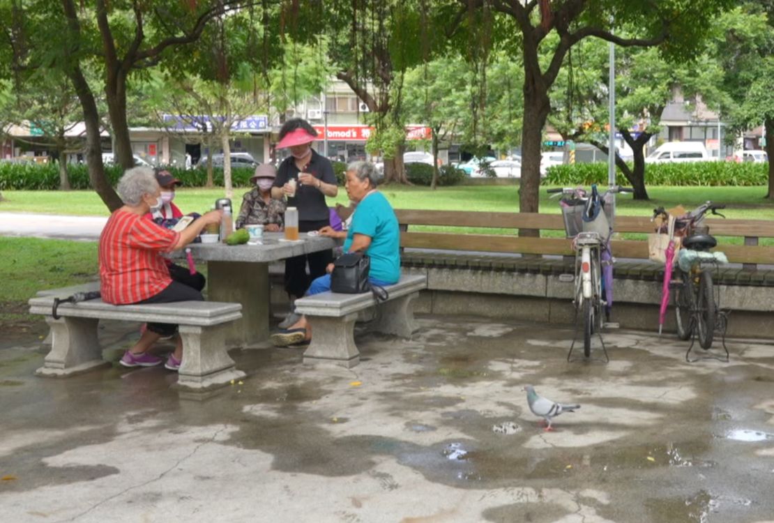 A group of older Taiwan women, including Huang and Chang, meeting up in a park in Taipei on Wednesday October 13.