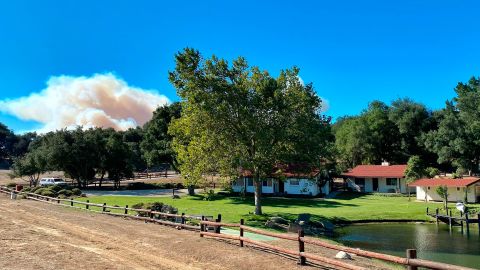 A smoke column builds in the distance behind Rancho del Cielo in Santa Barbara County.