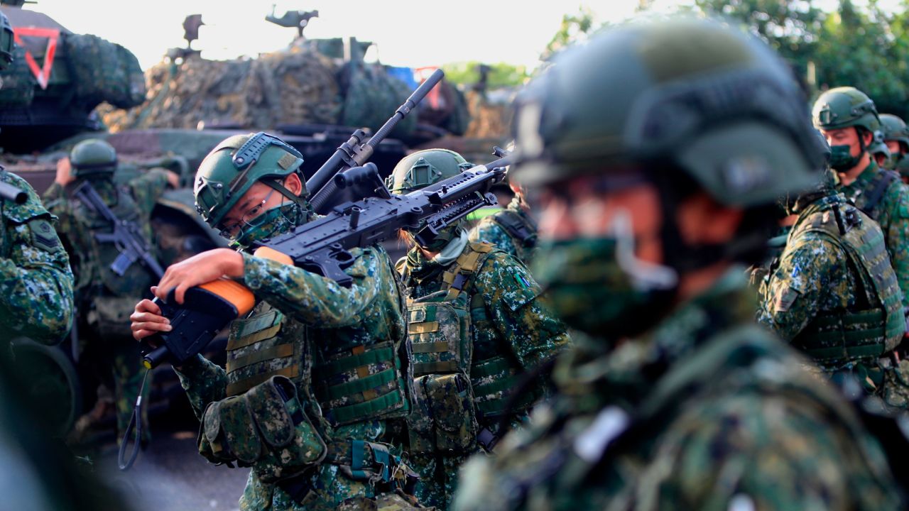 Taiwanese soldiers prepare grenade launchers, machine guns and tanks in a drill preparing for a Chinese invasion in Tainan, Taiwan, on September 16, 2021.