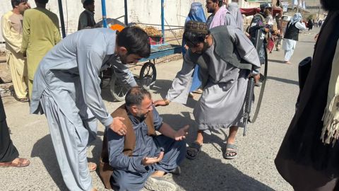 People react near the scene after the explosion.