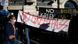 People hold a banner reading No Green Pass during a protest in Rome, Friday, Oct. 15, 2021.  