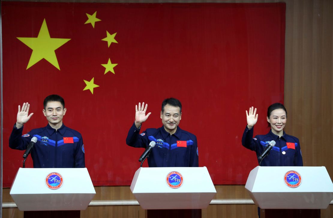 From left, astronauts Ye Guangfu, Zhai Zhigang, and Wang Yaping, meet the press at the Jiuquan Satellite Launch Center on October 14 before their departure to Tiangong space station.