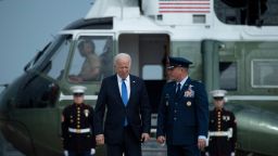 US President Joe Biden is greeted by Col. Matthew Jones (R), Commander, 89th Airlift Wing, as Biden arrives to board Air Force One at Joint Base Andrews in Maryland on October 15, 2021. - Biden is traveling to Hartford and Storrs, Connecticut. (Photo by Brendan Smialowski / AFP) (Photo by BRENDAN SMIALOWSKI/AFP via Getty Images)