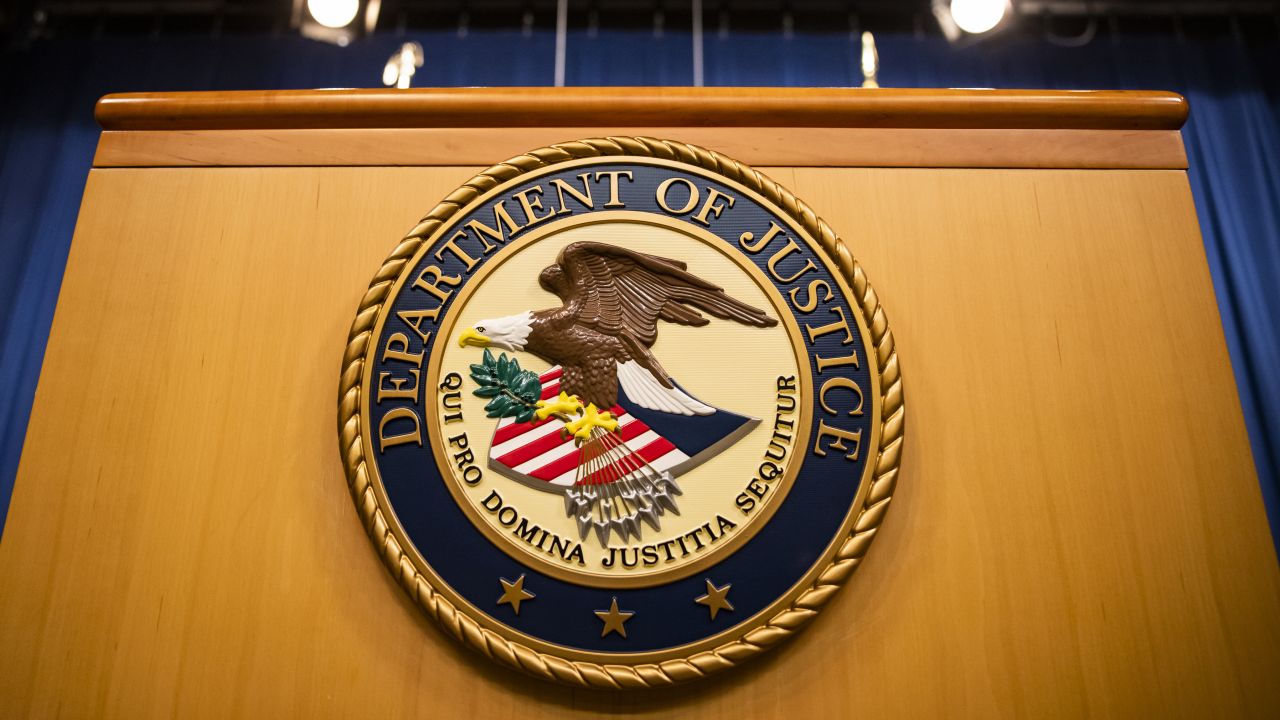 The US Department of Justice seal on a podium in Washington, DC, on August 5, 2021. 