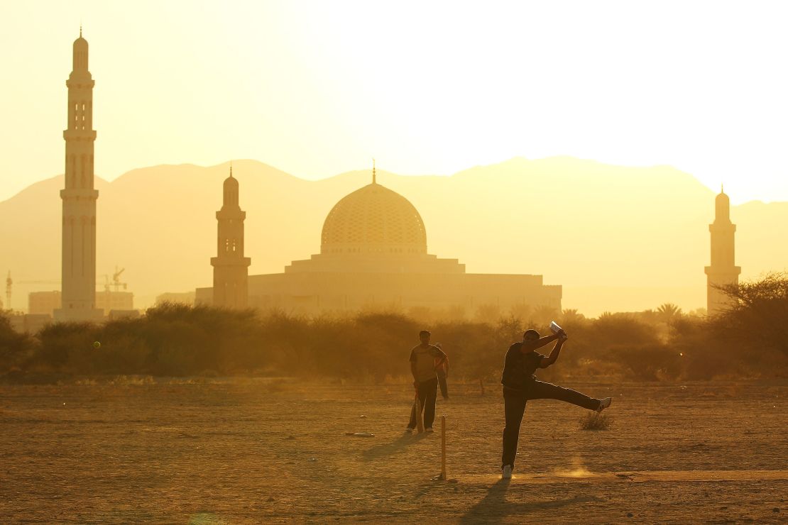 Locals play a cricket match in Muscat in December 2010.