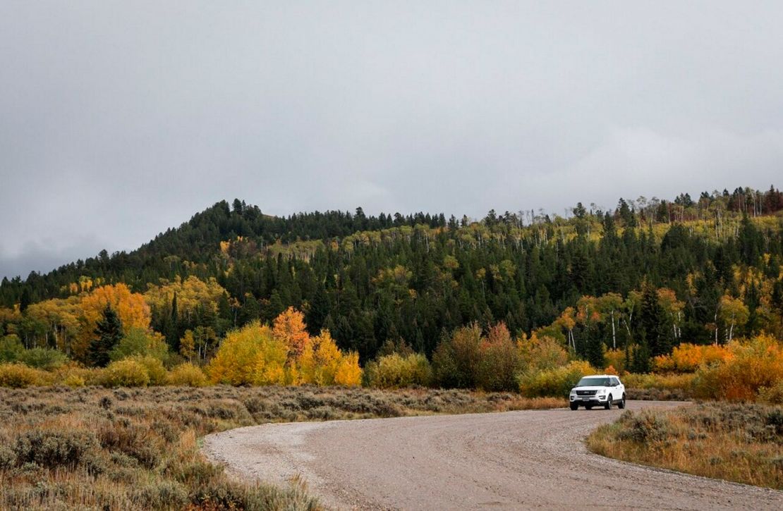 A vehicle drives in the Bridger-Teton National Forest, just east of Grand Teton National Park in Wyoming, Sunday, September 19, 2021. 