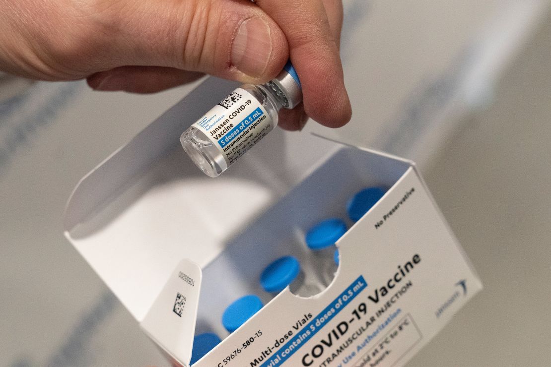 A pharmacist holds a vial of the Johnson & Johnson Covid-19 vaccine at a hospital in Bay Shore, New York.