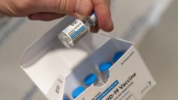 A pharmacist holds a vial of the Johnson & Johnson COVID-19 vaccine at a hospital in Bay Shore, N.Y. 
