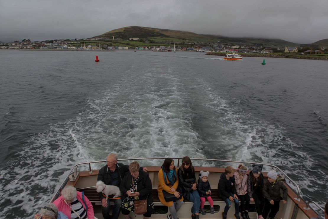 Tourists sail from Dingle harbor to sea for a special memorial service.