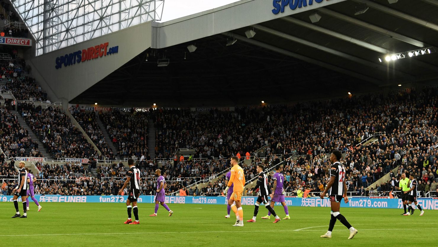 Players leave the pitch after a medical emergency in the crowd stops play shortly before half time during the Premier League match between Newcastle United and Tottenham Hotspur at St James' Park.