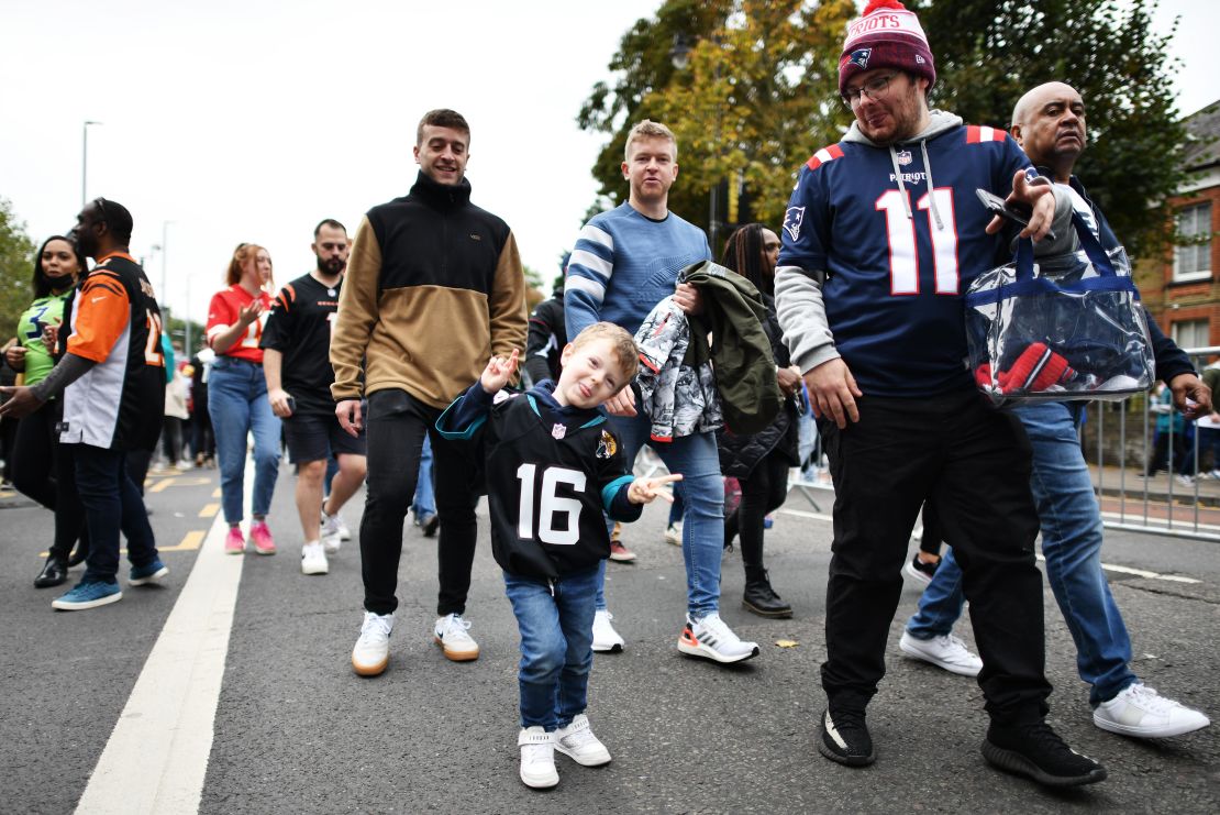 Fans arrive ahead of the NFL match between Miami Dolphins and Jacksonville Jaguars.