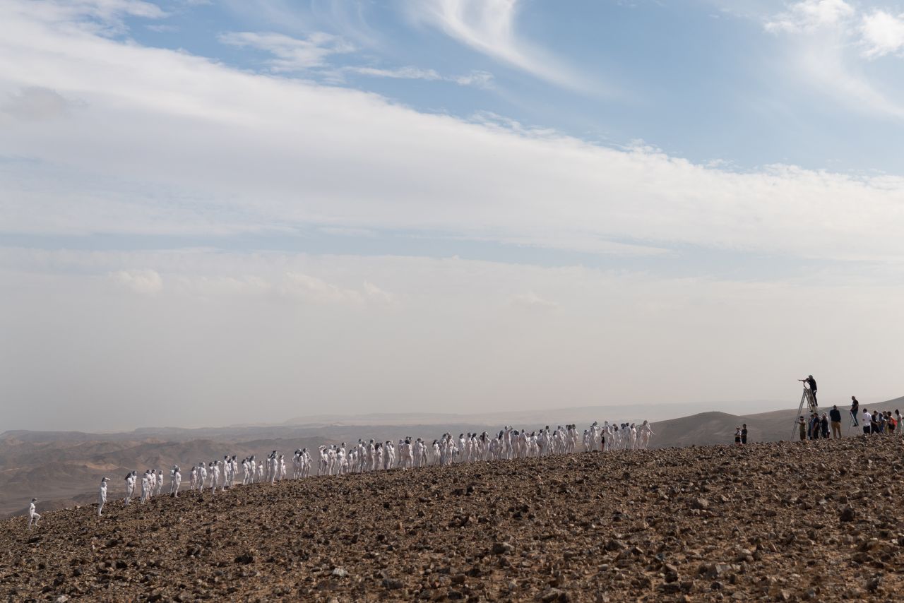 Artist Spencer Tunick oversees the photo shoot by the Dead Sea.