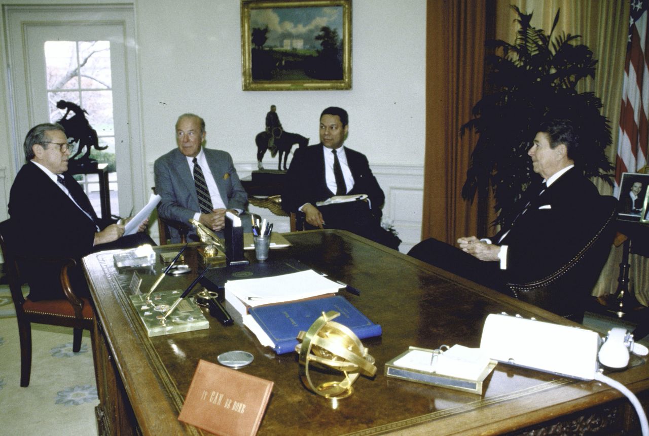 Powell became the nation's first Black national security adviser in 1987. From left here are White House Chief of Staff Howard Baker, Secretary of State George Shultz, Powell and President Ronald Reagan. They were discussing an upcoming summit with Soviet leader Mikhail Gorbachev.