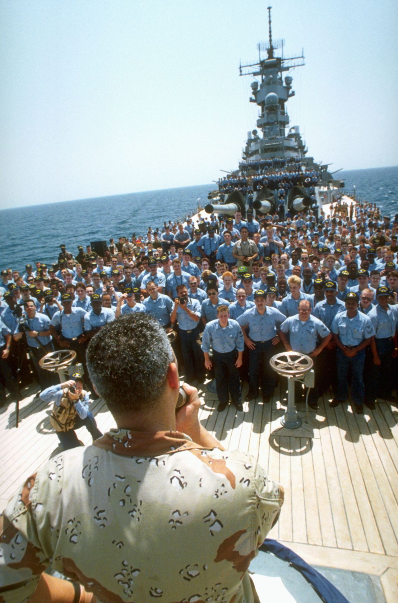 Powell addresses the crew of the USS Wisconsin during Operation Desert Shield in 1990.