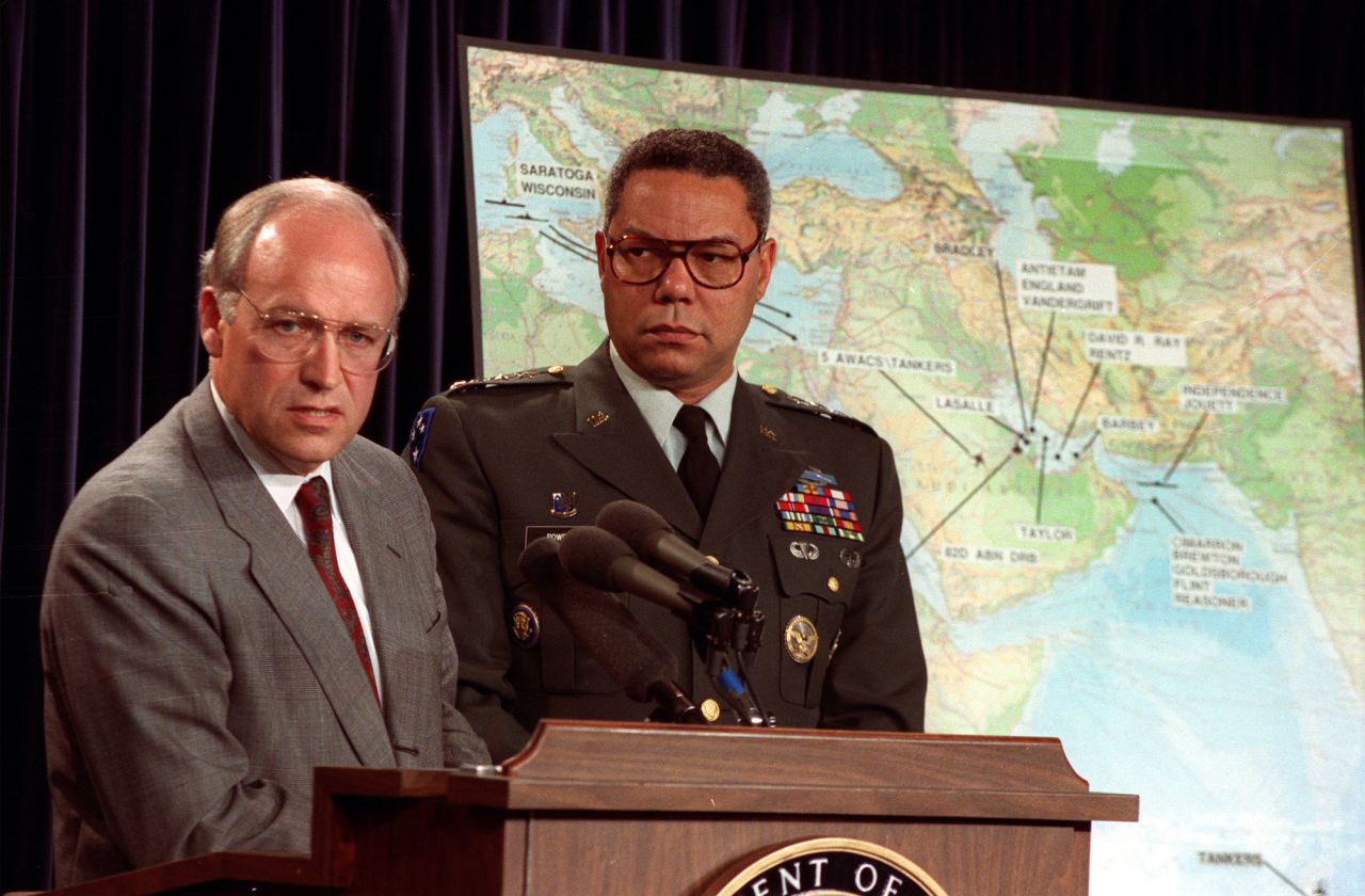Powell and Cheney talk to reporters during a Pentagon briefing in 1990.