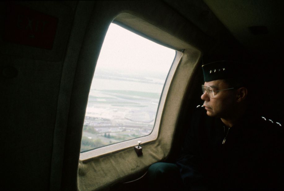 Powell flies over Arlington, Virginia, in a Blackhawk helicopter in 1996.