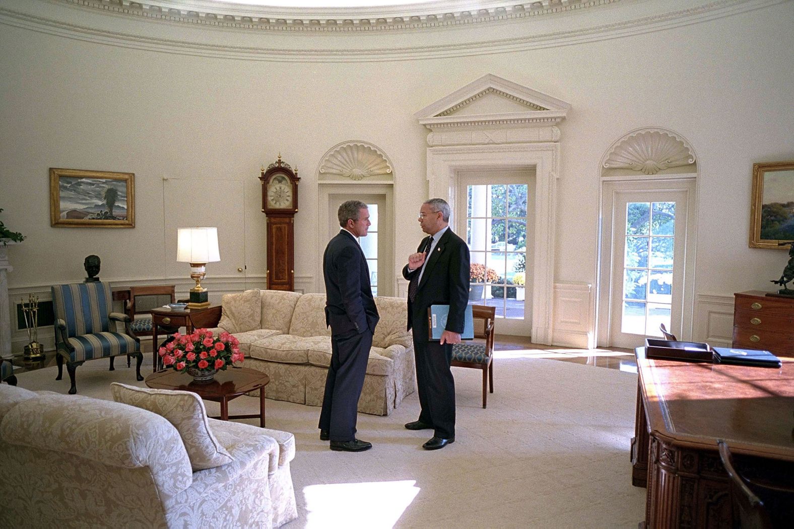 Bush and Powell meet in the White House Oval Office in 2001.