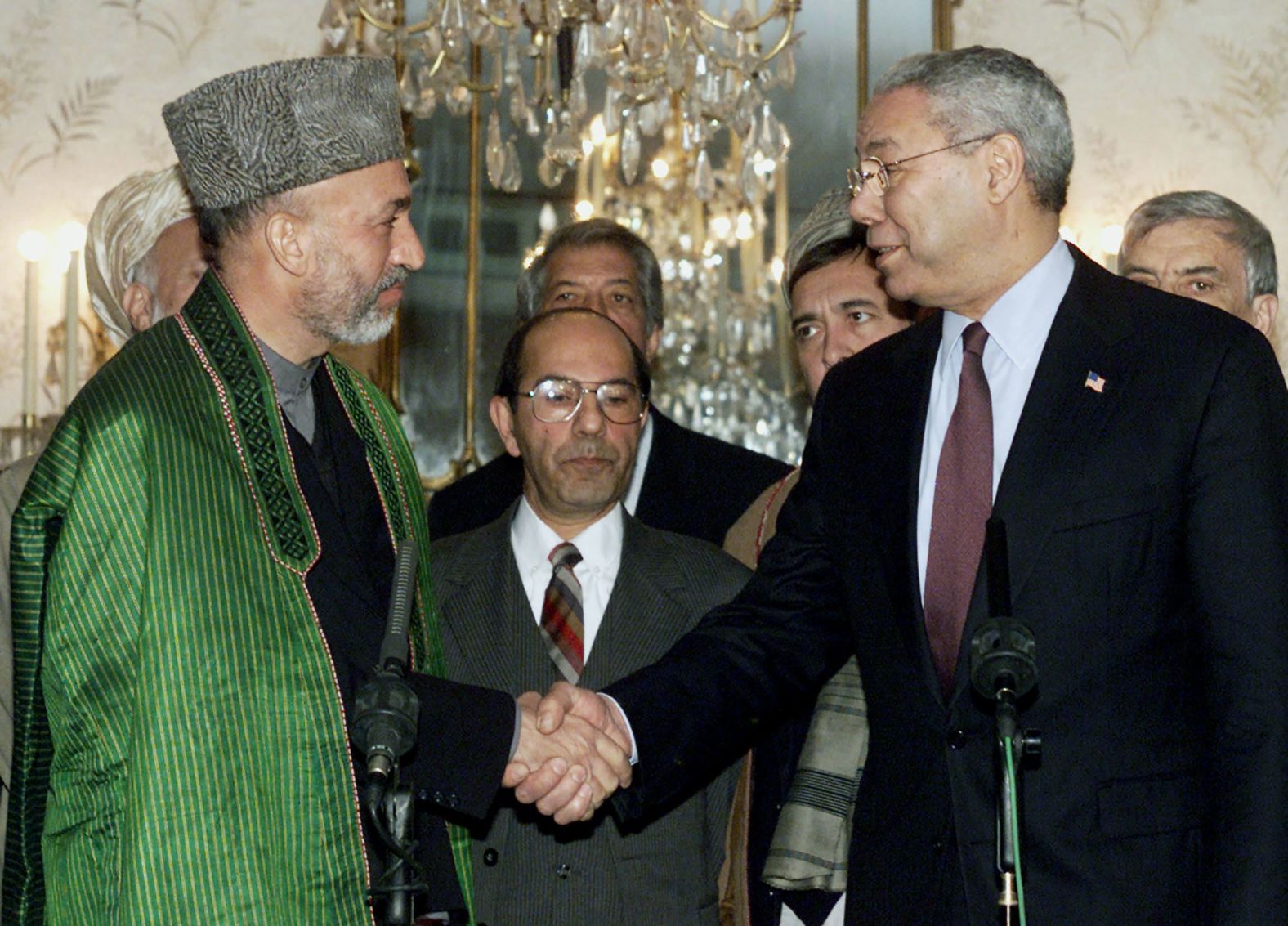 Powell shakes hands with Afghan Prime Minister Hamid Karzai in 2002. It was the first time a US secretary of state had visited Afghanistan since 1976.