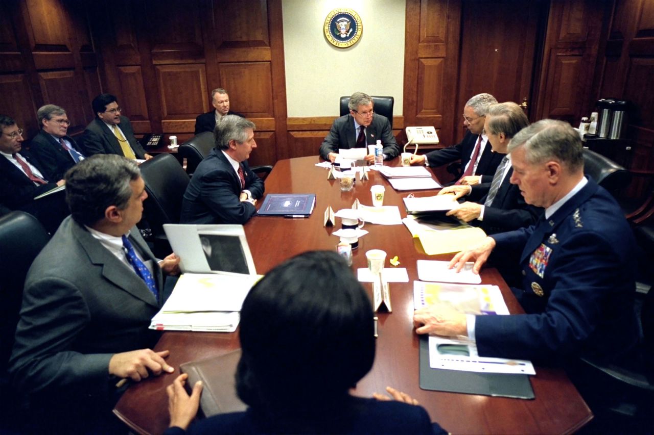 Bush meets with his war council in the White House Situation Room in 2003. Powell is next to Bush on the right.