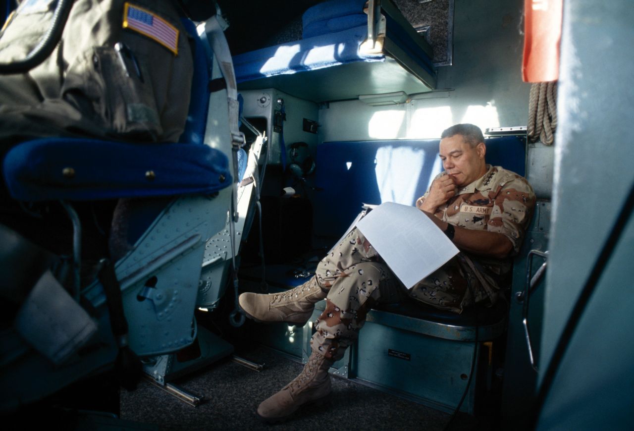 Powell reads aboard the USS Wasp while it was off the coast of Somalia in 1993.