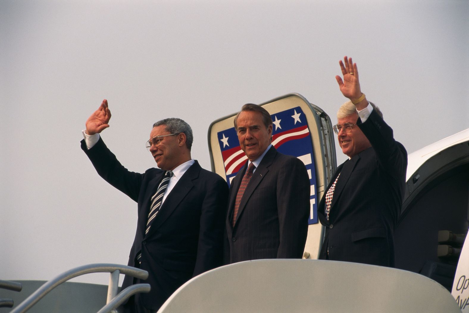 Powell joins Republican candidate Bob Dole, center, and Dole's running mate, Jack Kemp, while the two were campaigning in Louisville, Kentucky, before the 1996 election.