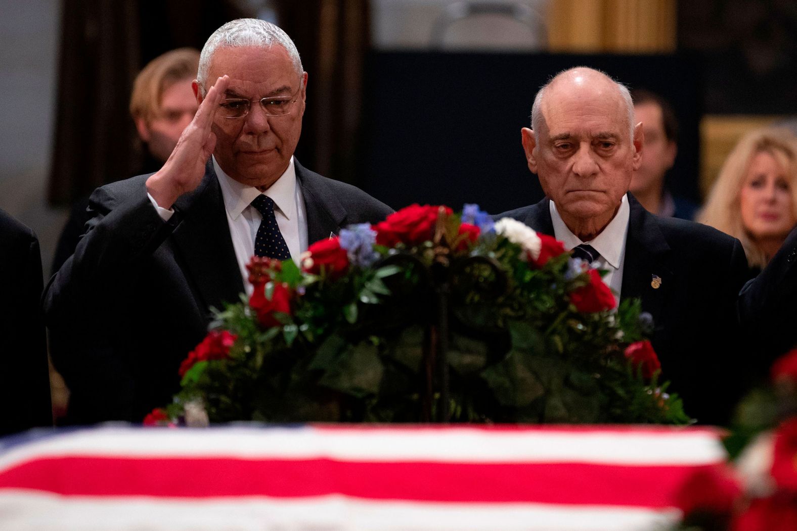 Powell salutes as he and other former military commanders pay their last respects to former President George H.W. Bush in 2018.