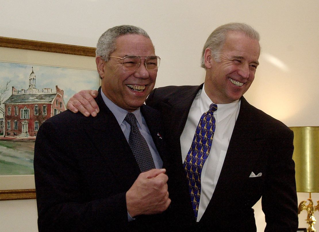 Secretary of State-designate Colin Powell, left, and Sen. Joseph Biden, D-Del., pose for photographers on Capitol Hill Tuesday, Jan. 9, 2001. 