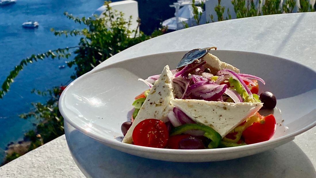 A traditional Greek salad, called horiatiki, has no lettuce. Instead, it's packed with plump, juicy tomatoes, cucumbers, green peppers, and onions, as well as several of the many varieties of Greek olives, and topped with large pieces of fresh feta and a dash of olive oil.