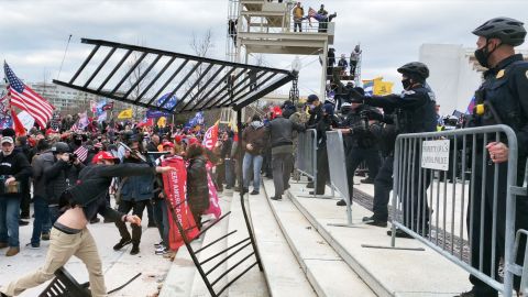 Rioters approach police in the HBO documentary 'Four Hours at the Capitol.'