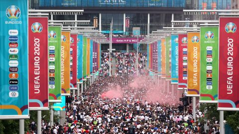 Supporters walk down Olympic Way ahead of the Euro 2020 final between Italy and England at Wembley Stadium on July 11, 2021.