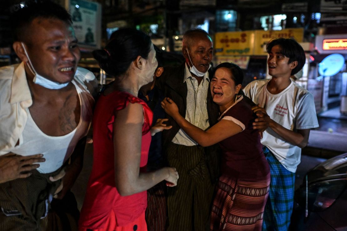A man is reunited with his family members following his release outside Insein Prison in Yangon, Myanmar, on October 18.