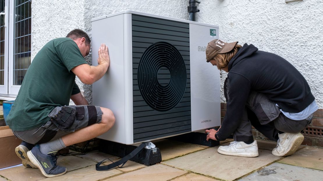 Workers from Solaris Energy installing an air source heat pump into a house in Folkestone, United Kingdom.