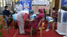Health workers take blood samples from the public for a national survey to ascertain the proportion of the population that have developed Covid-19 antibodies, in New Delhi, India, on Sept. 27, 2021. 