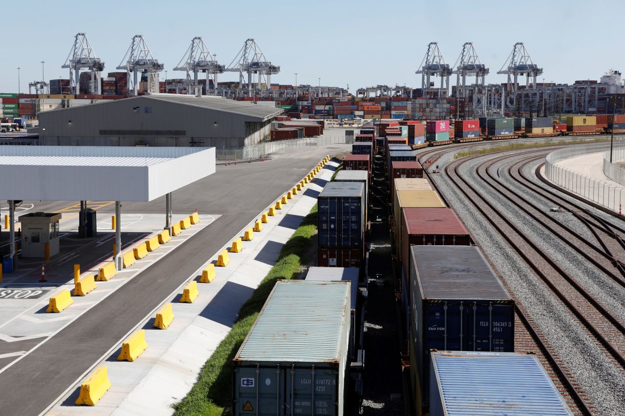 A commercial freight train carries a load of shipping containers on October 17 at the Port of Savannah in Georgia.