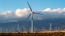 Wind turbines stand out in the desert landscape near the Tehachapi Mountains on February 16, 2021 in Rosamond, California. F