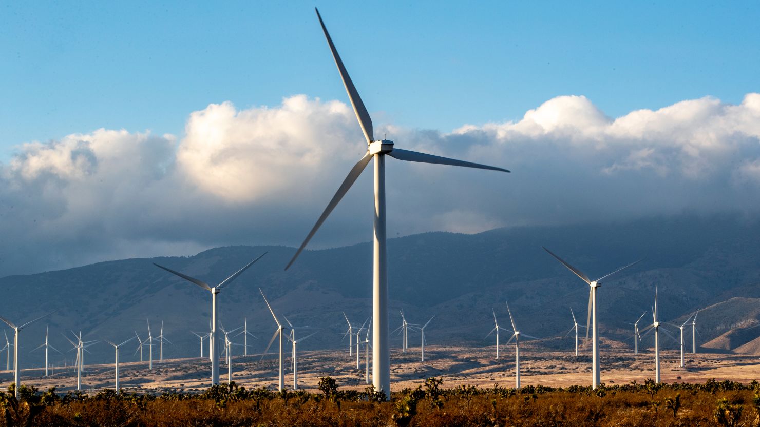 Wind turbines near the Tehachapi Mountains on in Rosamond, California. Analysts at Rhodium Group found President Joe Biden's climate goals could be achieved with clean-energy tax credits along with regulatory and state action.