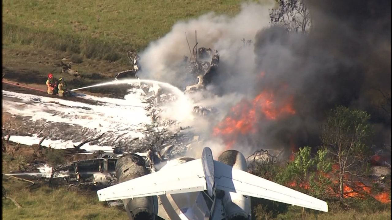 A plane carrying 21 people struck fence and erupted in flames while taking off in Houston on Tuesday.