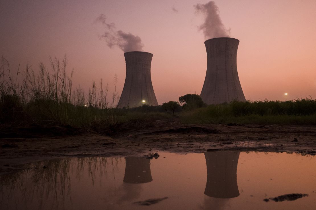 The cooling stacks at a coal-fired power plant in Uttar Pradesh, India. A report from the UN shows countries like India are planning to produce more fossil fuels in the next decade than what they can afford under current climate commitments.