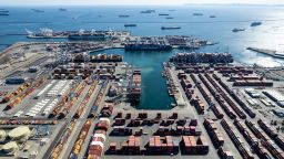 Aerial view of container ships waiting to enter and unload at the port of Long Beach on October 16, 2021 in Long Beach, California.