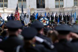 President Joe Biden accompanied by first lady Jill Biden, Secretary of Homeland Security Alejandro Mayorkas, FBI Director Christopher Wray and others listen the national anthem, during a ceremony, honoring fallen law enforcement officers at the 40th annual National Peace Officers' Memorial Service at the US Capitol in Washington, Saturday, October 16, 2021. 